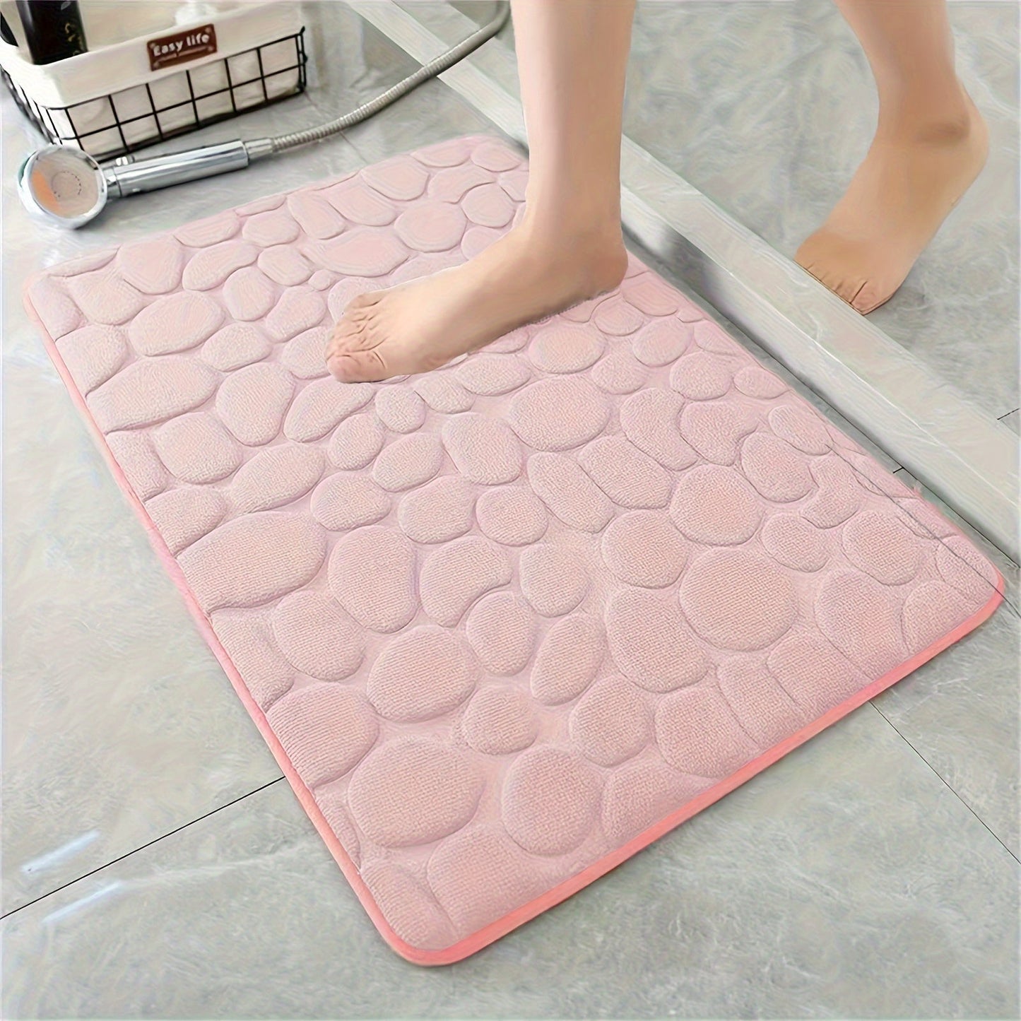 Soft and comfortable Plush Memory Foam Bath Rug featuring Cobblestone Embossment. This quick-dry, non-slip rug is machine washable and perfect for showers and bathrooms. Add a touch of luxury to your space with this ideal fall decor accessory.