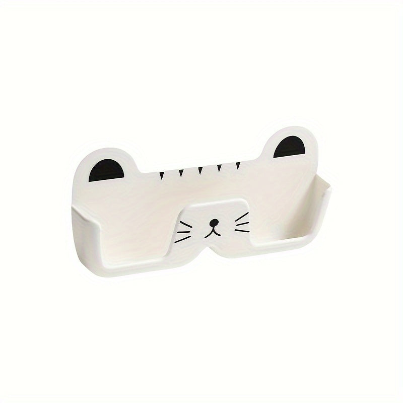 Wall-mounted whimsical cat eyeglass holder made of punch-free plastic, designed to store and display glasses in a space-saving and fashionable manner.