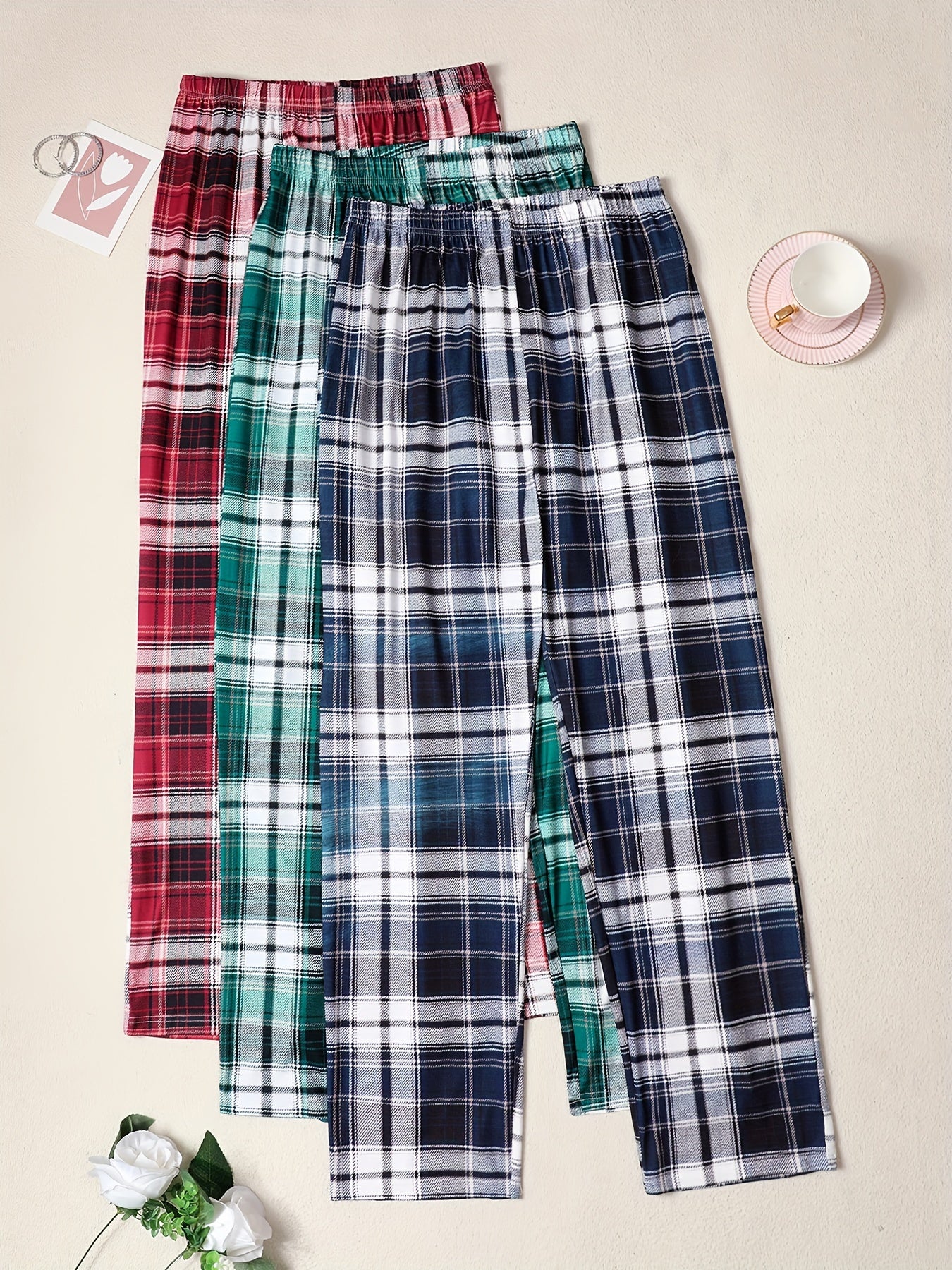 3-pack of men's plaid pajama pants with comfortable medium stretch knit fabric in assorted designs.