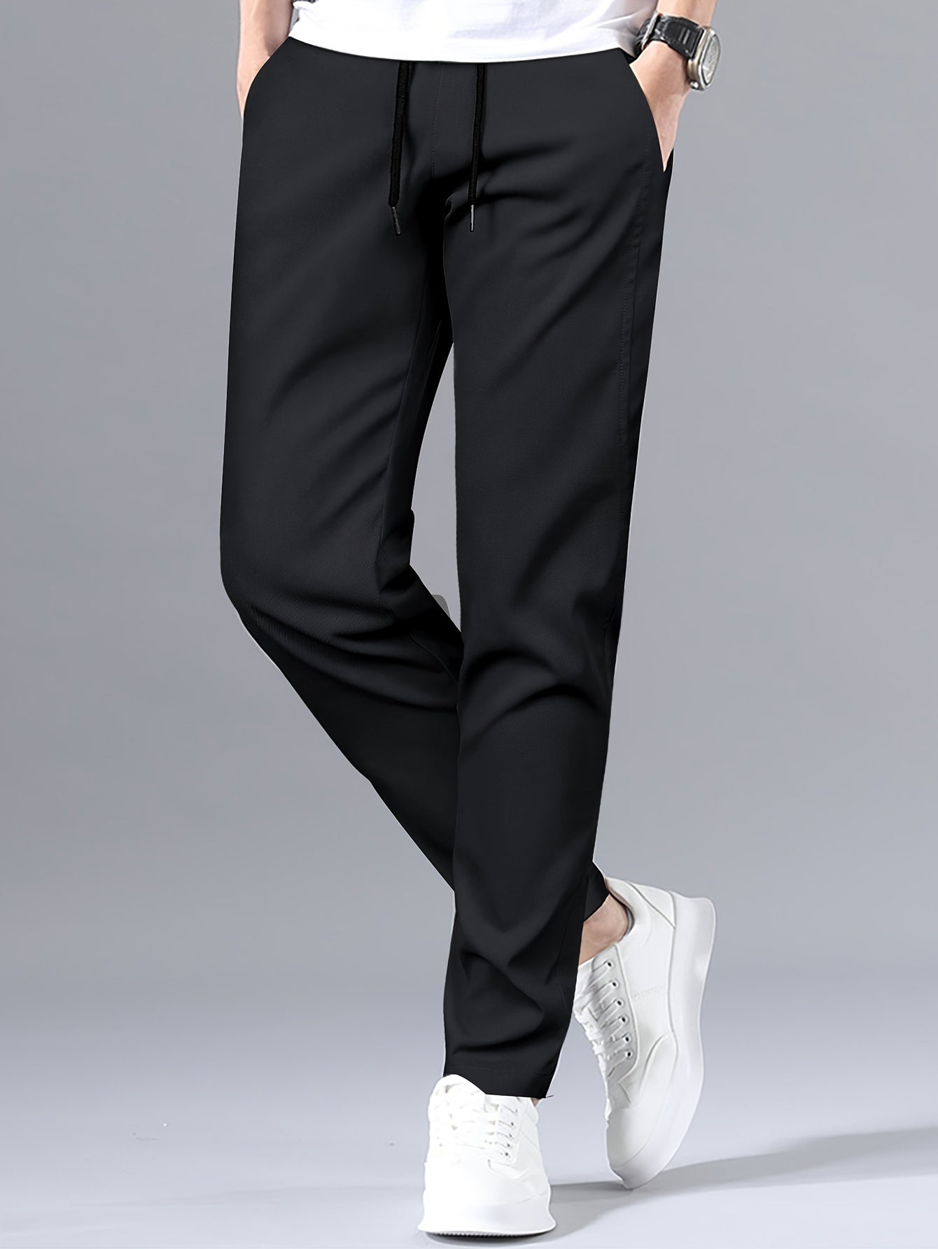 Stylish men's solid pants with pockets, casual and breathable drawstring trousers for outdoor activities.