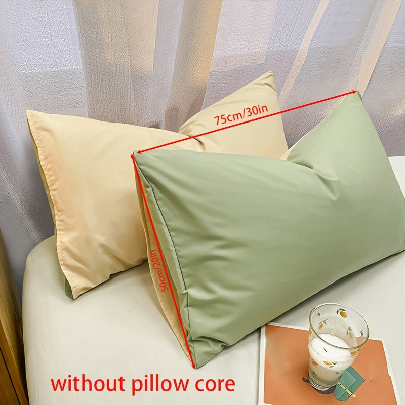 Get two ultra-soft brushed polyester pillowcases, weighing 90g each in a sleek light purple color. These rectangular pillowcases measure 50.8x76.2cm and feature an envelope closure. They are machine washable and perfect for adding cozy comfort to your