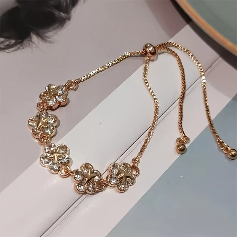 Elegant flower bracelet with rhinestones, zinc alloy fashion jewelry for women. Adjustable chain, suitable for daily and party wear. Great gift for friends.