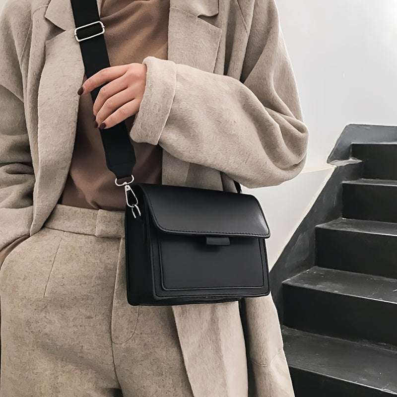 Retro crossbody bag for women in stylish brown with adjustable strap and metal ring detail. Features a compact flap design for everyday use.