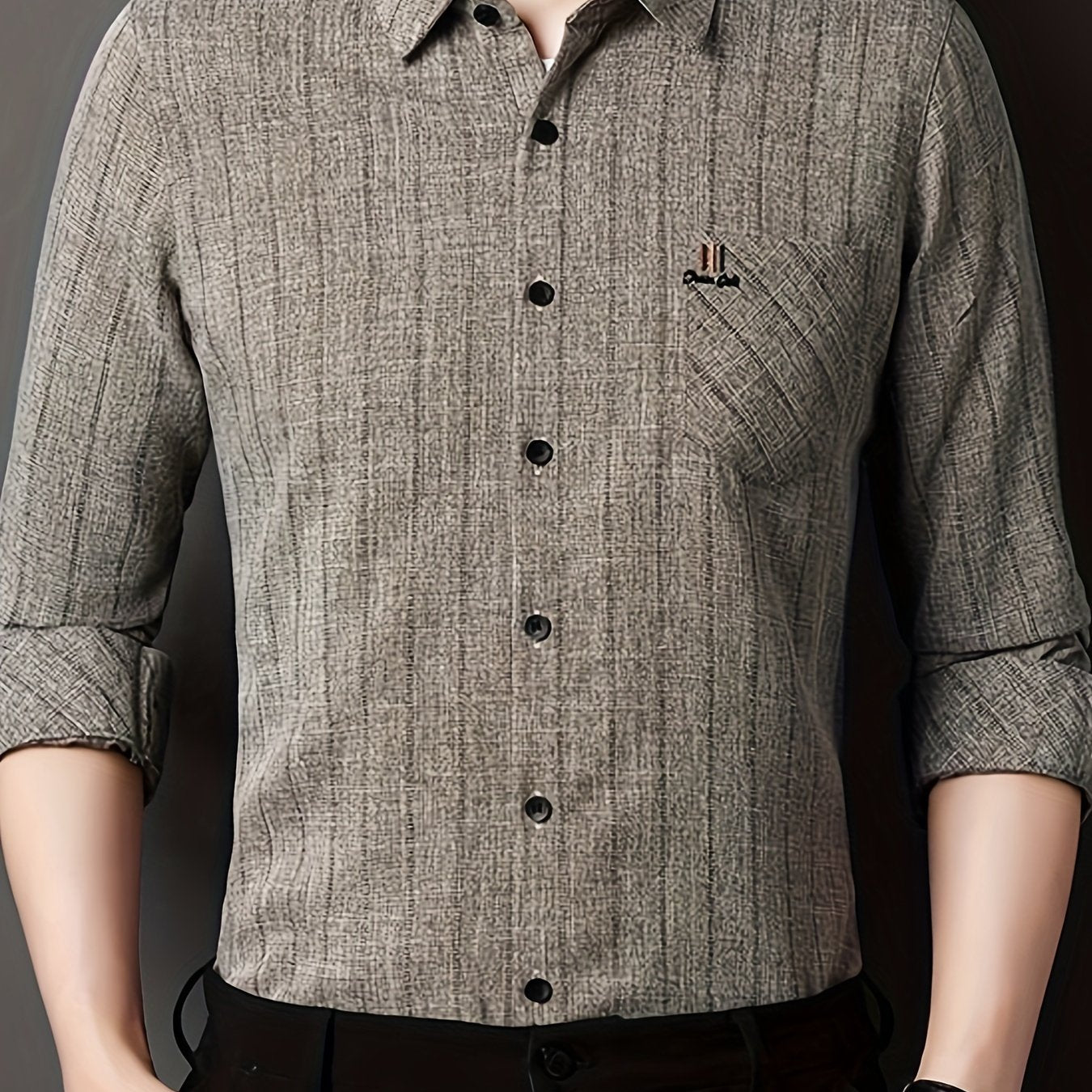 Men's striped shirt with chest pocket, collar, and long sleeves.