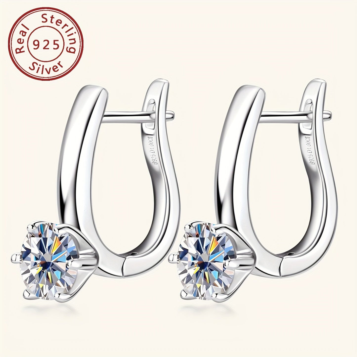 These beautiful earrings feature round Mozambique stone earrings with a stunning D Color, set in 6.5mm sterling silver. The six-claw U-shaped 925 silver ear cuffs add an elegant touch to these ladies' jewelry gifts. The silvery weight of these earrings