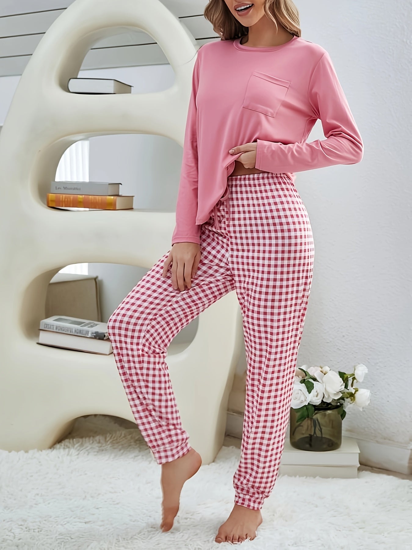 Women's cozy fall lounge set includes solid long sleeve top and plaid jogger pants for a relaxed fit.