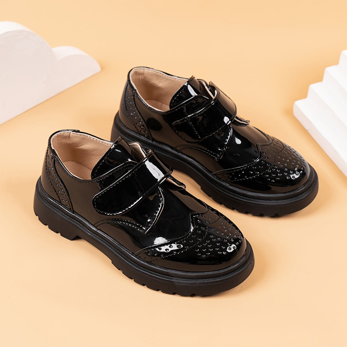 Breathable loafers for boys in shiny black PU with hook-and-loop closure, suitable for weddings, parties, and casual wear. Lightweight and comfortable for all seasons.