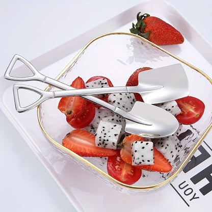 Set of 4 adorable stainless steel shovel spoons for dessert and fruit scooping in the home.