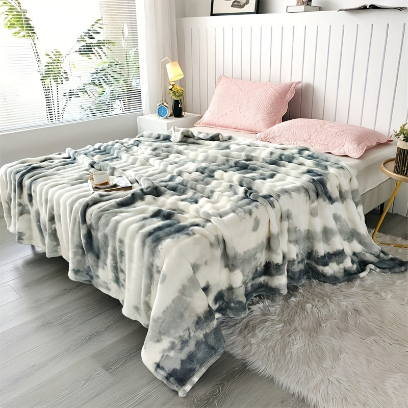 Modern soft faux rabbit fur bed blanket with a tie-dye plush flannel design, featuring a thick dual layer for ultimate coziness in all seasons. Made of machine washable polyester in a rainbow moire pattern, perfect for the sofa, living room, or bed.