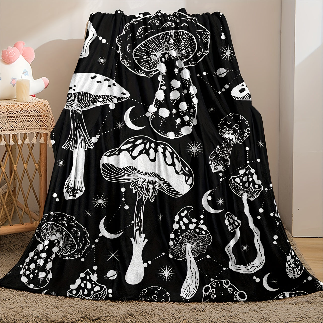 Stay cozy with this stylish Black and White Mushroom Patterned Flannel Blanket, perfect for naps, snuggling, or keeping warm. This versatile and lightweight blanket is a great gift for the home, providing comfort in the living room, bedroom, office, or