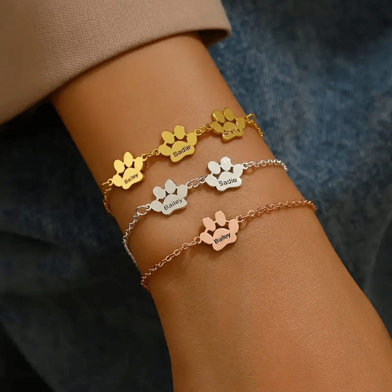 Our unique custom stainless steel cat paw bracelets showcase pet paw prints and can be personalized with 1-4 names. These Bohemian-style bracelets are adorable keepsake gifts for pet owners, ideal for birthdays and Christmas. They make simple yet