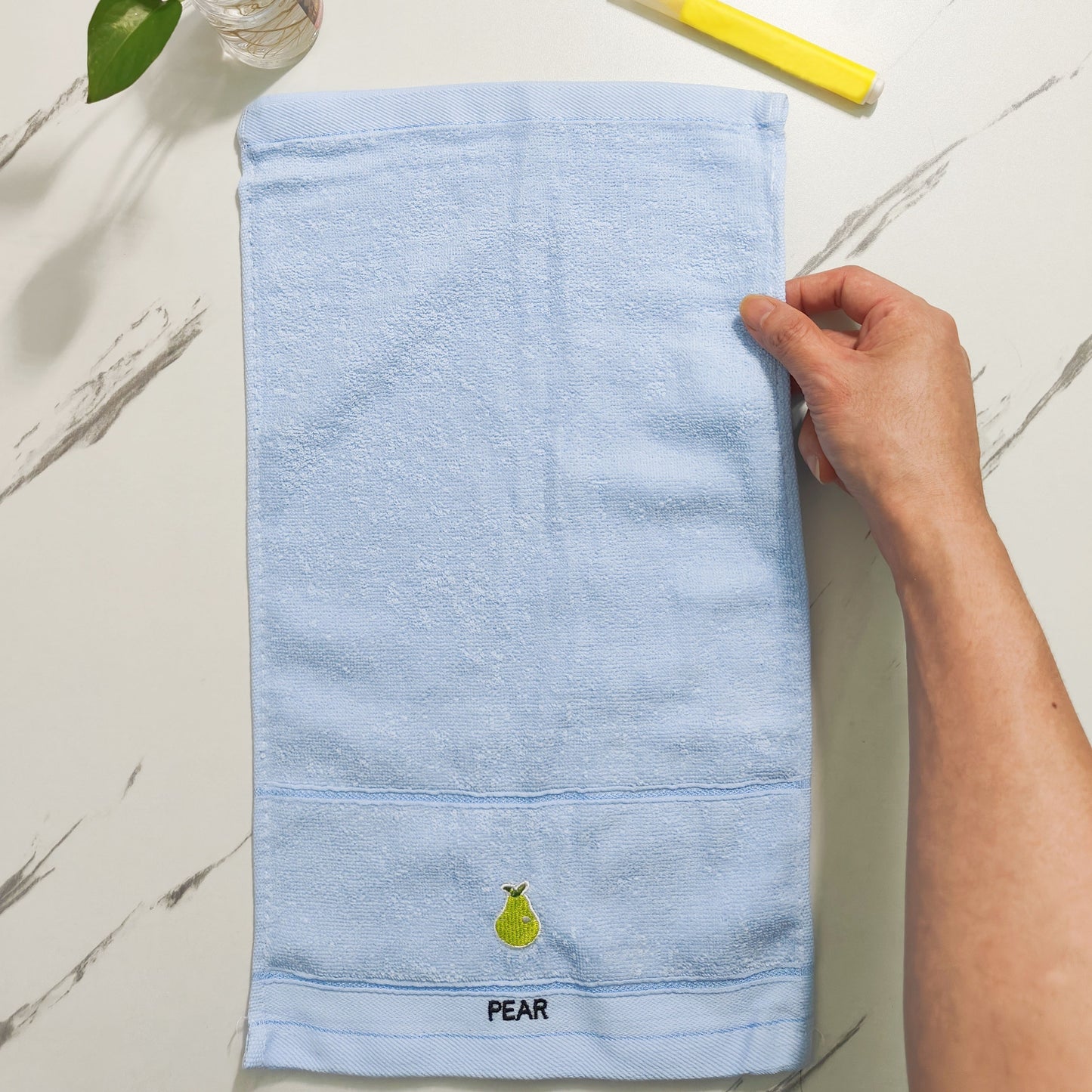 Five soft cotton fingertip towels with fruit patterns ideal for everyday use in the bathroom.