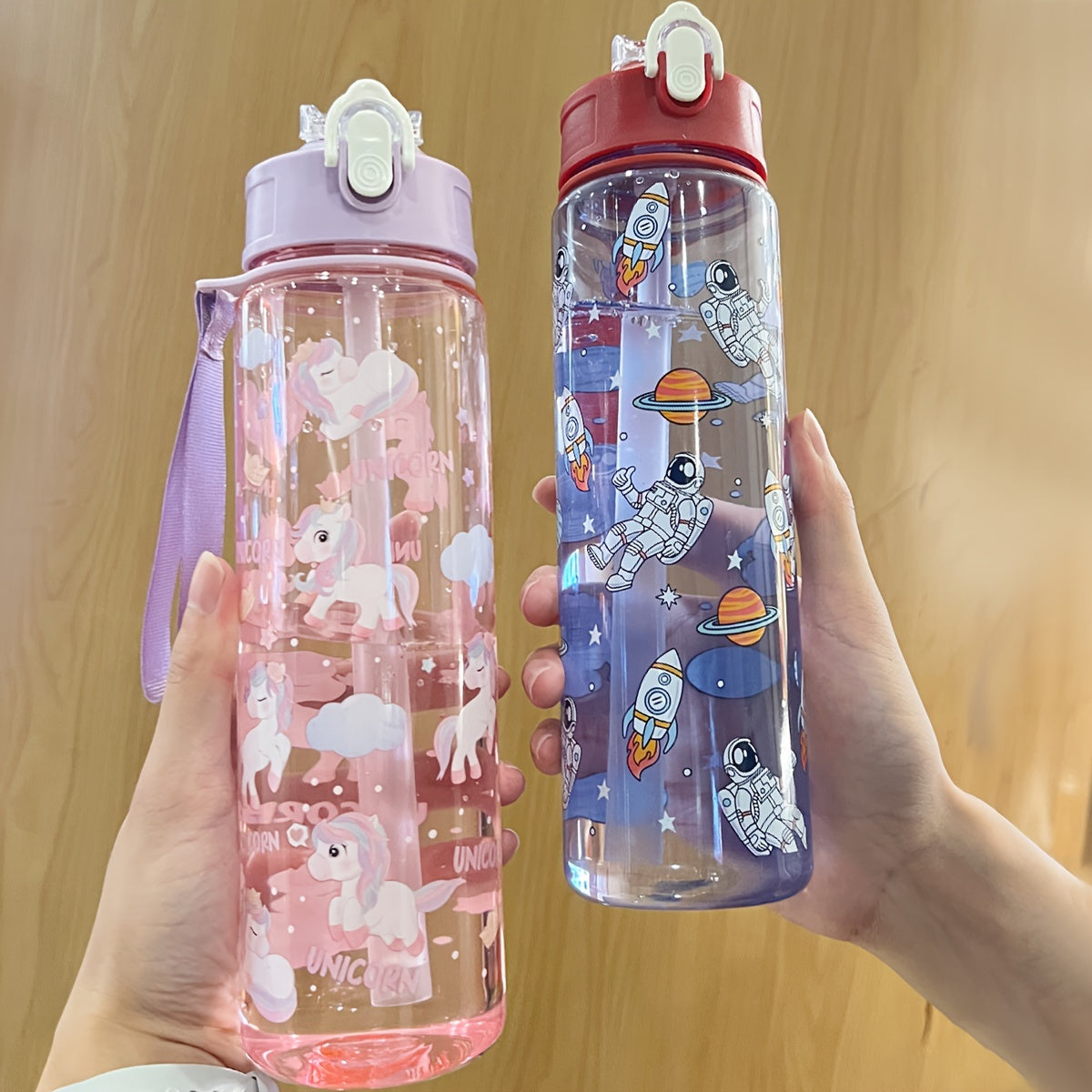 WhimsyWorks Cartoon Unicorn & Astronaut leak-proof water bottle made of PVC-free plastic for outdoor activities. Easy-open lid, hand wash only. Portable with woven handle, perfect for picnics, cycling, running, exercise. Great Christmas, Halloween