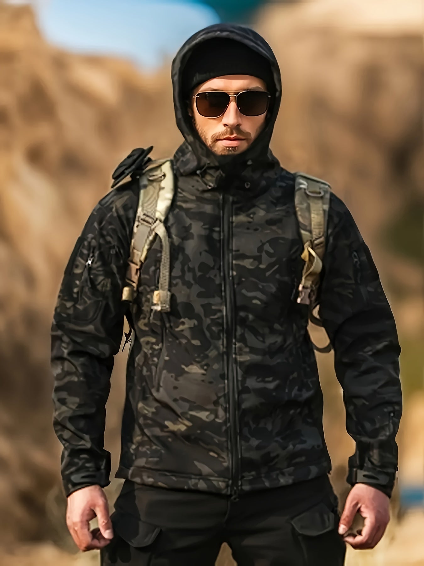 Men's camo outdoor gear set includes a windproof hooded jacket and fleece-lined pants with multiple pockets, suitable for hiking, hunting, and casual wear.