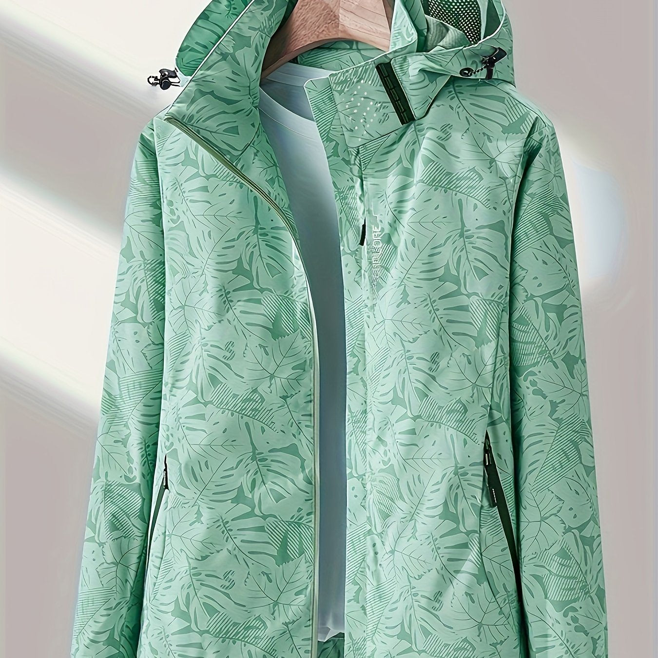 Women's casual windbreaker jacket made of 100% polyester with a waterproof stand collar, zippered placket, and long sleeves. This jacket features a woven fabric, regular length, and random