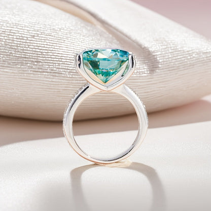 This stunning 10CT Teal Moissanite Engagement Ring features a sparkling 925 silver band, making it the ideal choice for weddings, parties, and as a December birthstone gift.