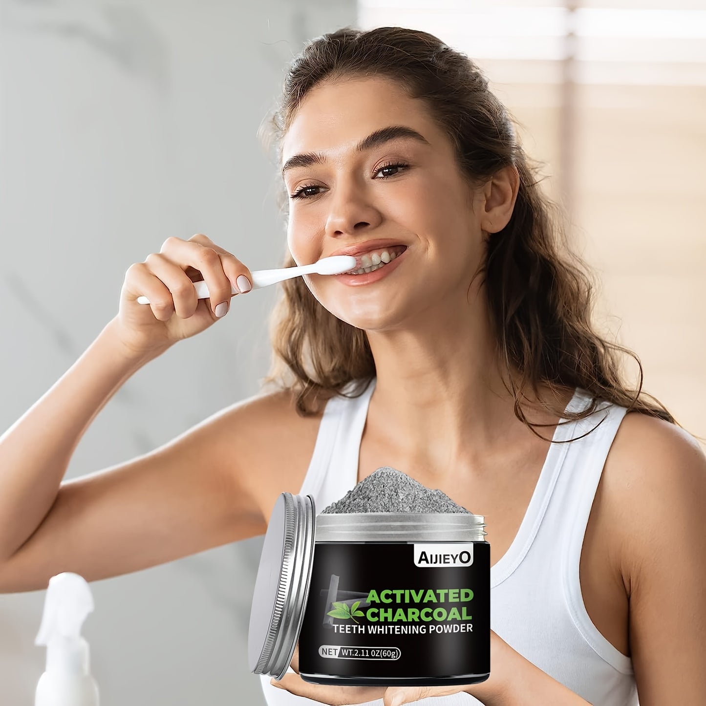 Charcoal teeth whitening powder with mint flavor freshens breath, brightens smile, and naturally whitens teeth and gums.