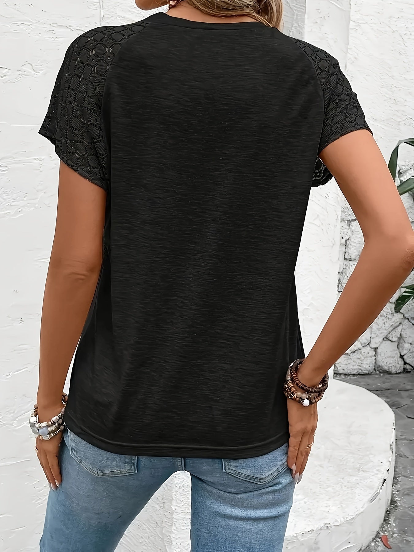 Elegant black short sleeve T-shirt for women with lace detail. Made of polyester with medium stretch. Suitable for spring, summer, and fall fashion. Features crew neck and knit fabric.