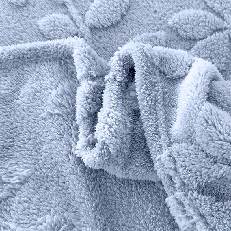 Cozy and contemporary, this jacquard embossed throw blanket is both stylish and versatile. Made from all-season polyester knitted fabric, it features a square weight of 200-250g and a sleek no print design. Perfect for napping or adding a touch of warmth