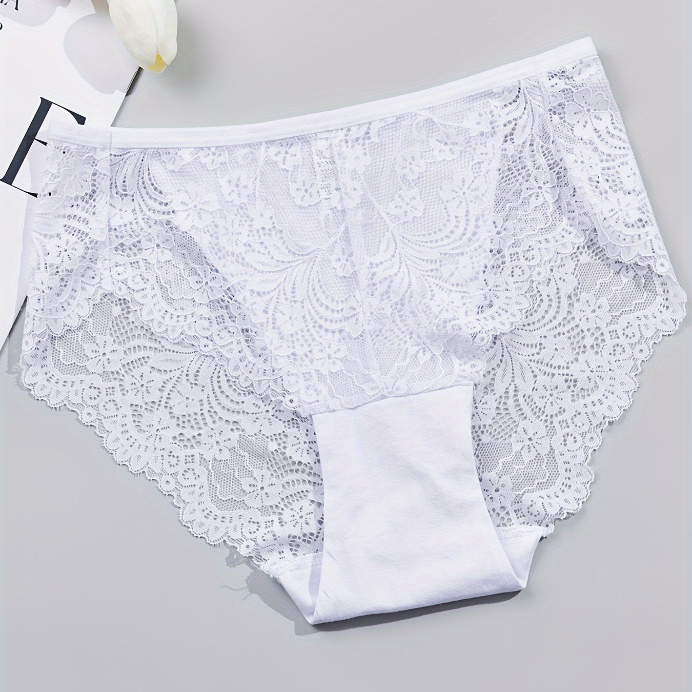 1 pair of women's lace-trimmed brief panties made from soft, breathable nylon blend for everyday wear, sleep, dates, and light sports. Cute and semi-transparent design.