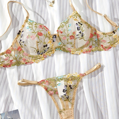 Floral embroidery underwear set with semi-transparent gathered bra and thong panties for a sexy and fresh look.