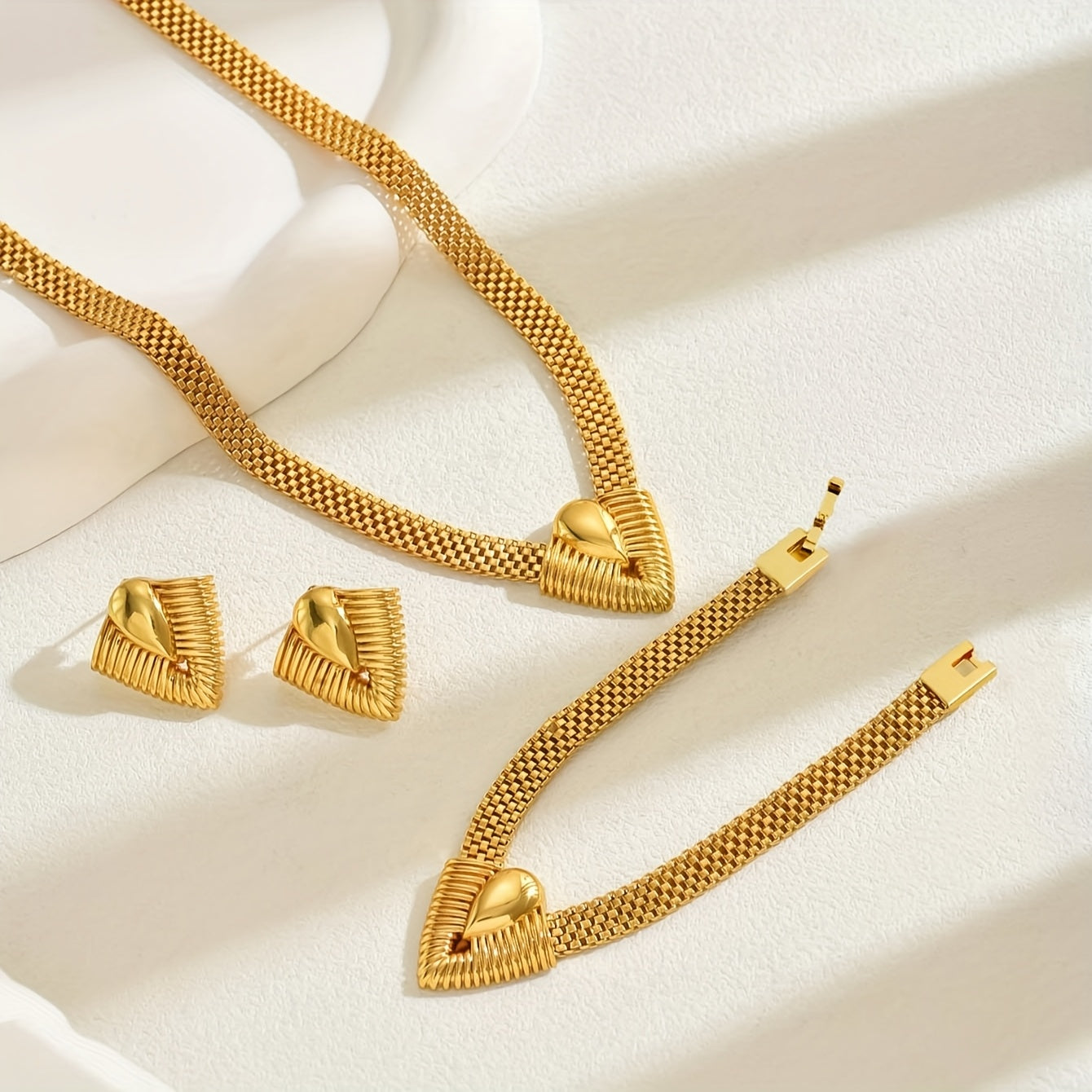 Set of 3 high-quality geometric V-shaped design jewelry pieces for women, including a necklace, bracelet, and earrings, all designed to accentuate the collarbone.