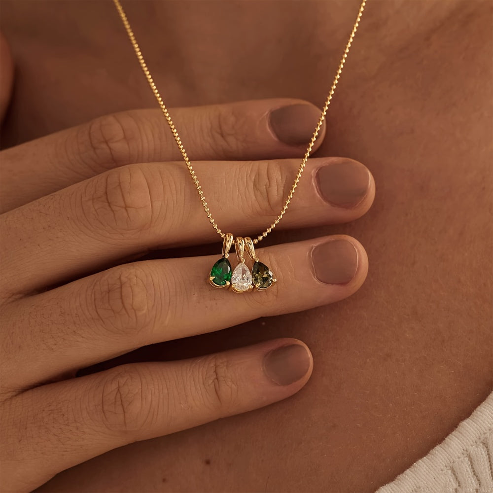 Customize your own Birthstone Necklace with up to five birthstones, plated in 18K gold. Enter the month in Arabic numerals for a personalized touch. This necklace makes a perfect gift for her, mom, or girlfriend for Christmas, Valentine's Day, or an