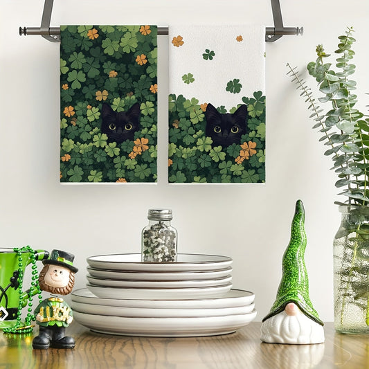 Two pieces of black cat clover St. Patrick's Day kitchen towels measuring 40.64x60.96 cm. These farmhouse holiday spring decoration hand towels are perfect for your kitchen.