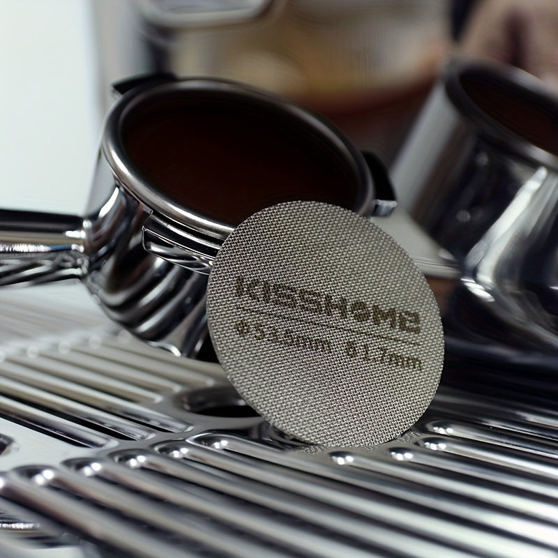 Reusable espresso puck screen made of 316 stainless steel, heat resistant, available in diameters of 51mm, 53.5mm, and 58.5mm. Compatible with Breville machines and 51mm, 54mm, and 58mm portafilters. Includes coffee accessories.