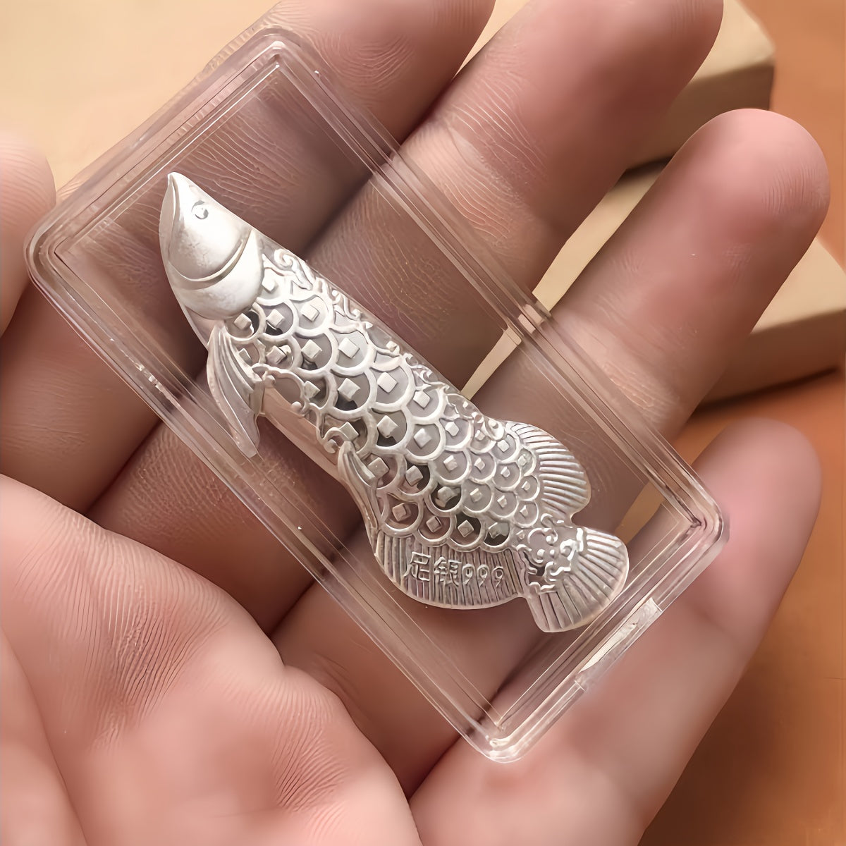 1 piece of silvery tea ceremony accessories for making tea and boiling water, a silvery dragon fish tea pet, and a silvery leaf for sterilizing and softening water quality.