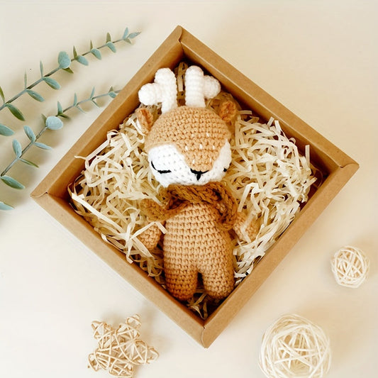 The perfect first Christmas gift for newborns: a handmade crochet baby animal Christmas reindeer doll. Perfect for little ones to snuggle with during the holiday season.