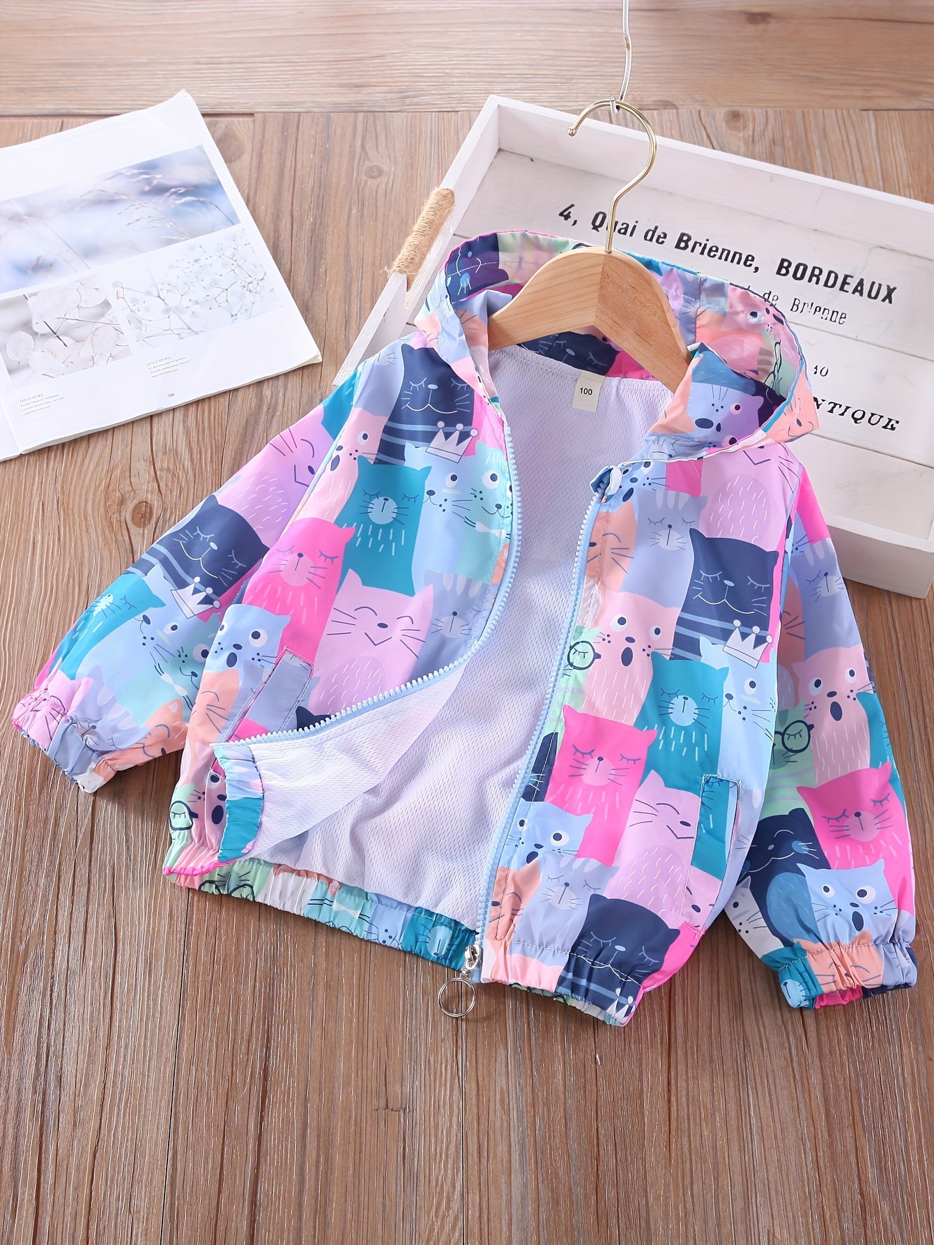 Women's lightweight windbreaker with colorful cat print, perfect for spring and fall outdoor activities.