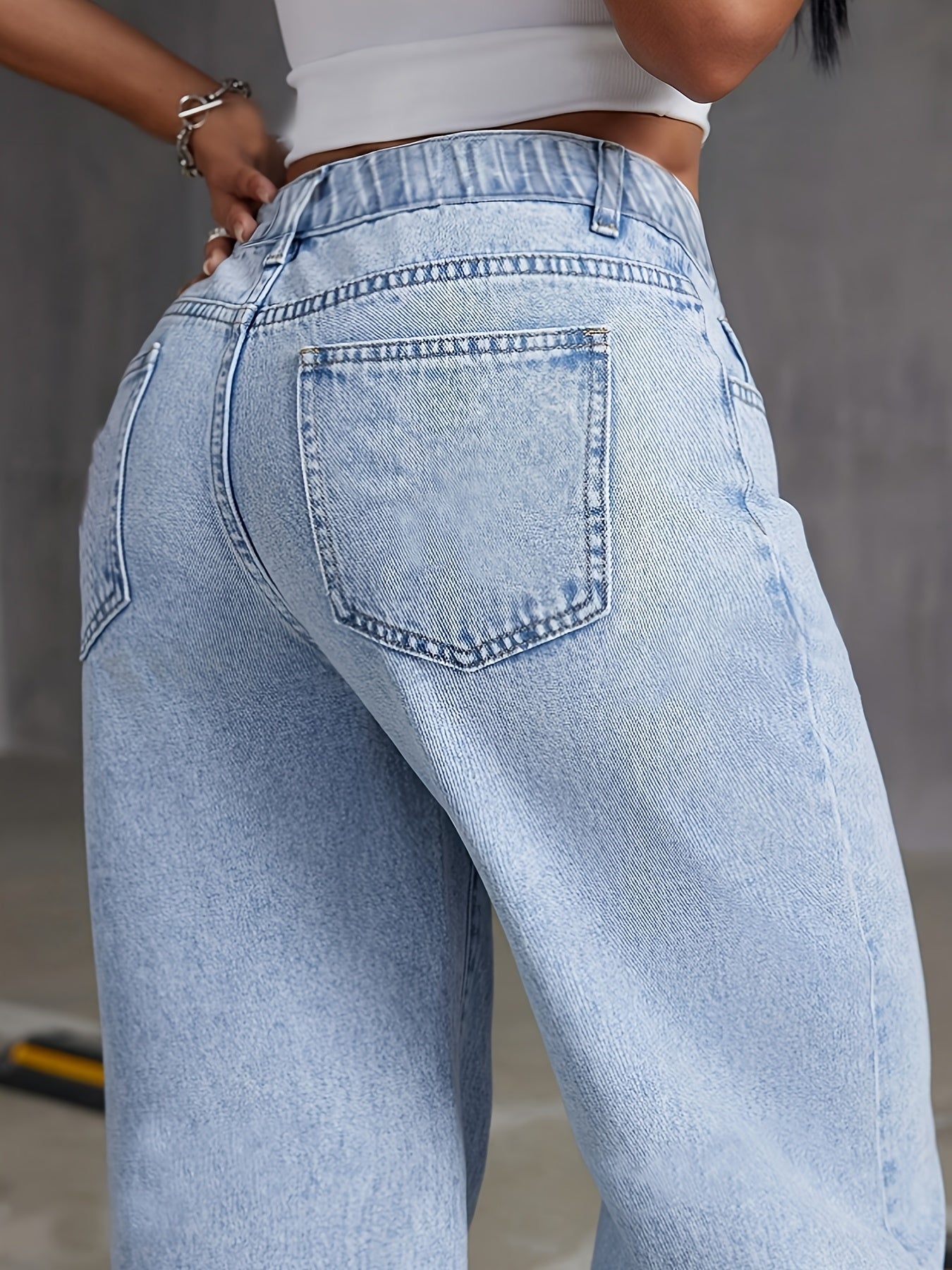 Preppy style high-waisted wide leg denim jeans for women, with button detail and solid color, perfect for all-season weekend wear.