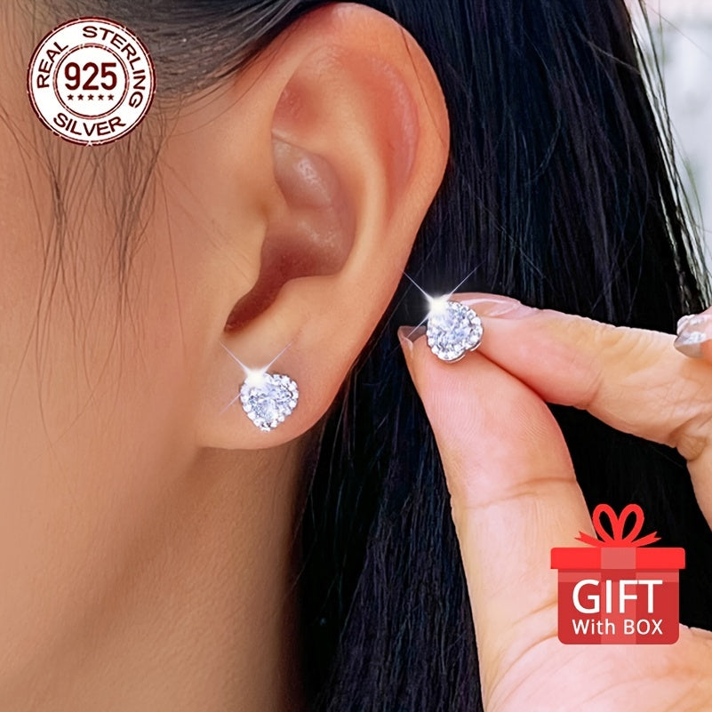 Get a pair of timeless heart-shaped synthetic zirconia stud earrings, perfect for any occasion. Made of 925 sterling silver plated material, these earrings are hypoallergenic and feature a simple round design. They come in a beautiful gift box, making