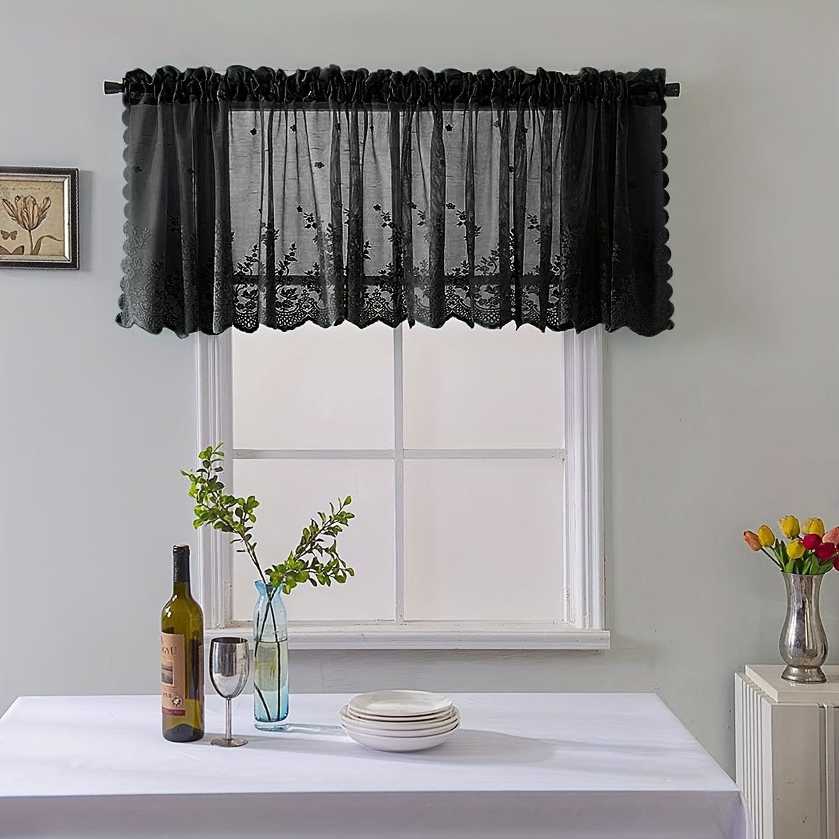 Elevate your space with this elegant black floral lace cafe curtain. Featuring a sweet and simple design, this curtain is made of sheer polyester and has a rod pocket for easy installation. Perfect for adding a touch of sophistication to your kitchen