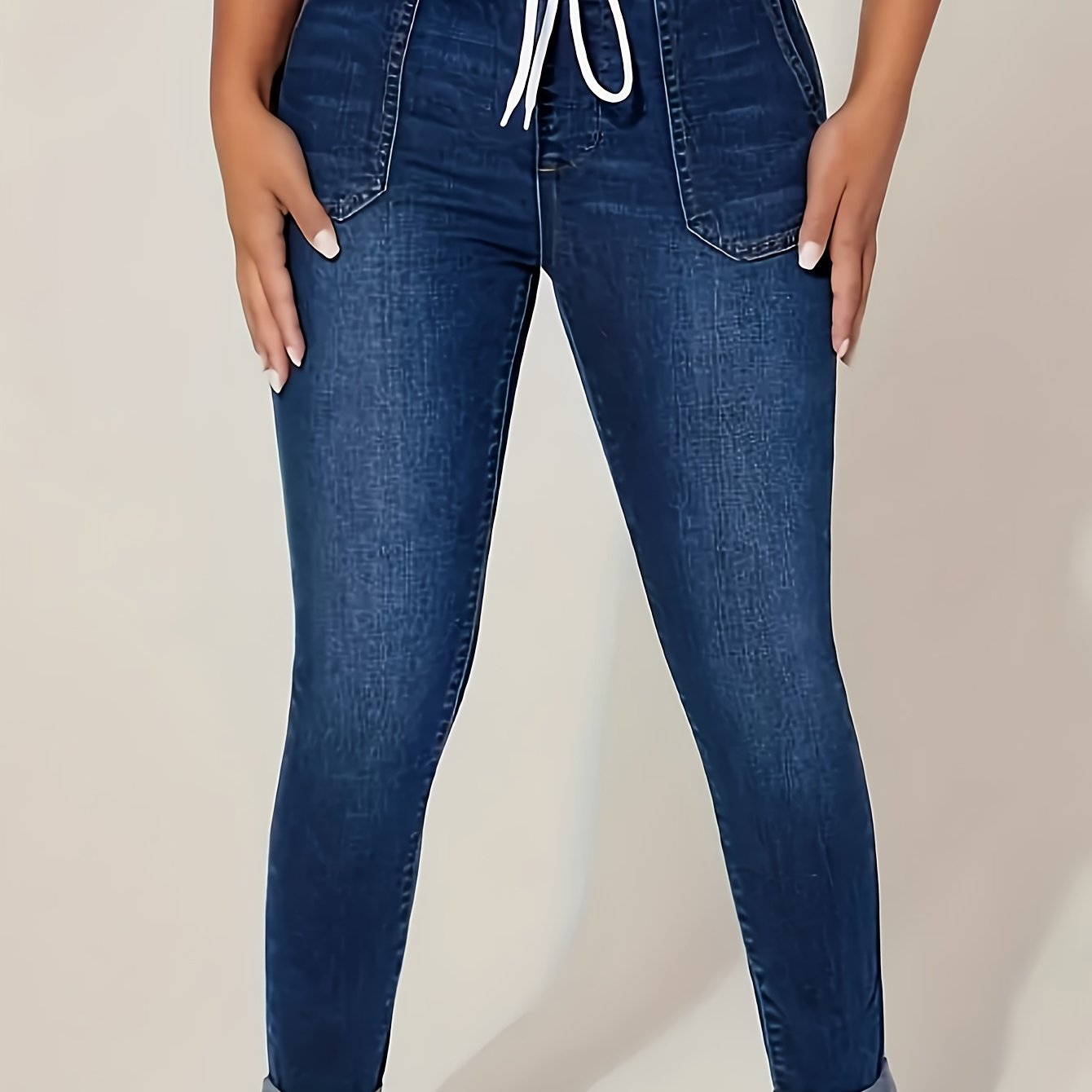 Plus size denim jeans for women with elastic drawstring waist and comfortable stretch fit.