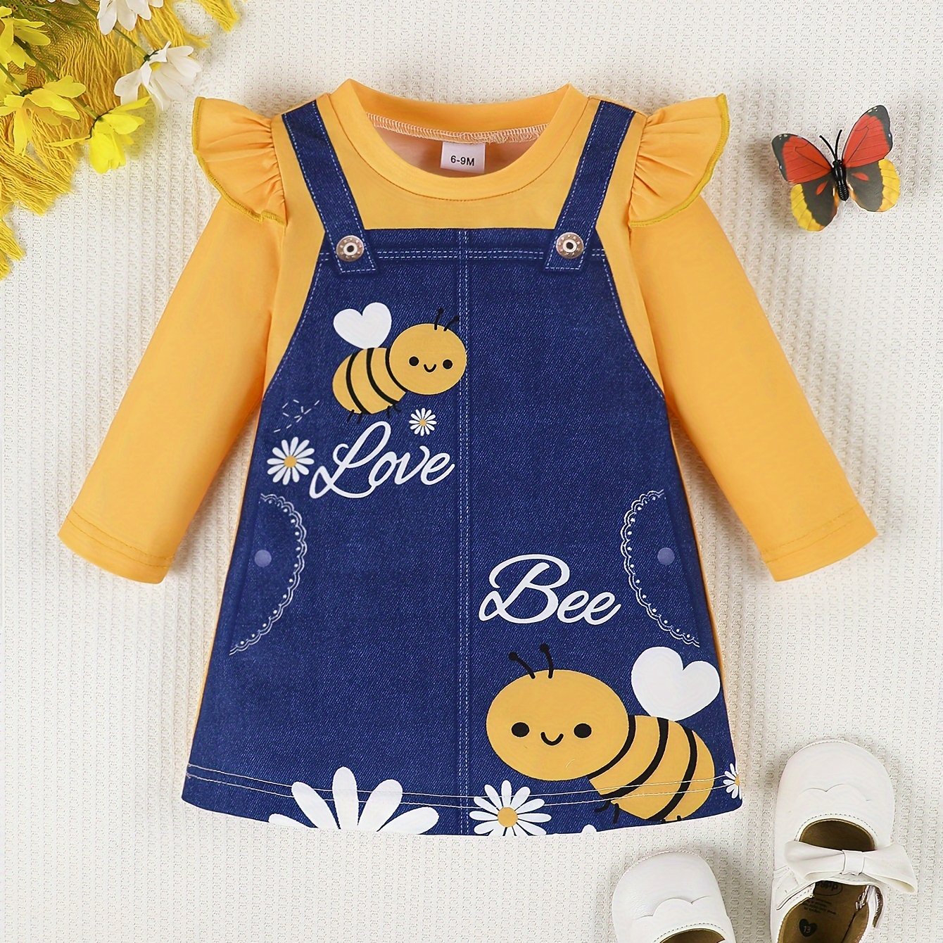 Spring dress for baby girls with lotus leaf sleeves, cute pattern, and flower bee design, both comfortable and fashionable.