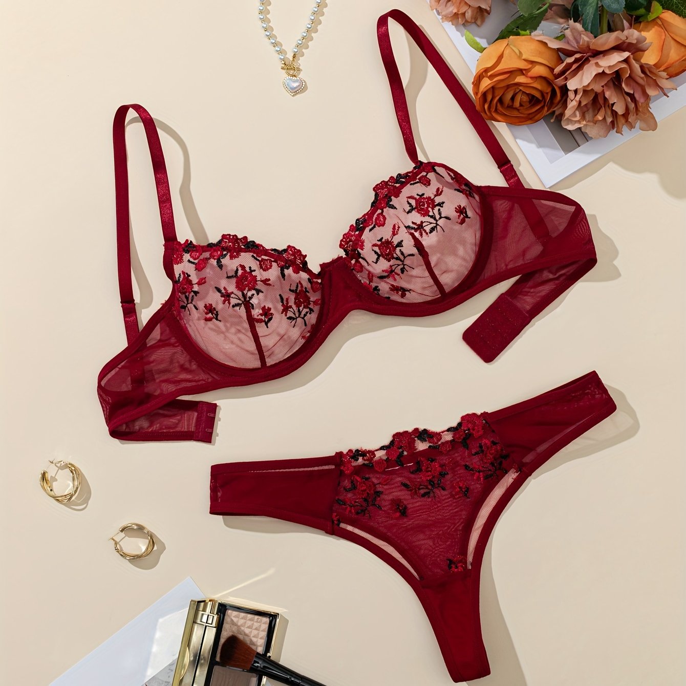 Stylish floral embroidered lingerie set for women made from polyester knit fabric. Features a breathable mesh bra and drop waist briefs with medium support. Comes in ditsy pattern and