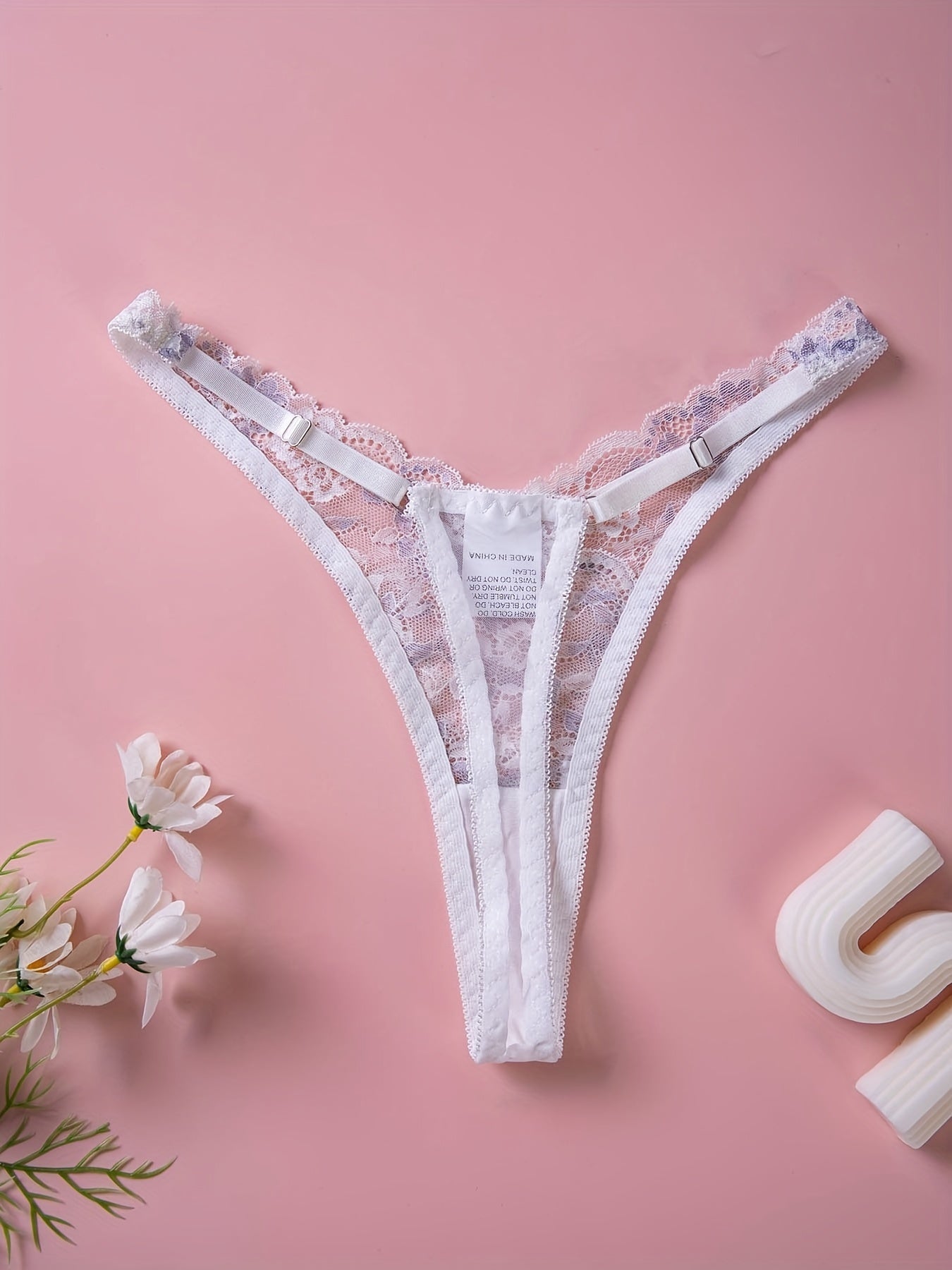 Sexy lingerie and underwear for women, including floral lace thongs and cut-out bow tie panties.