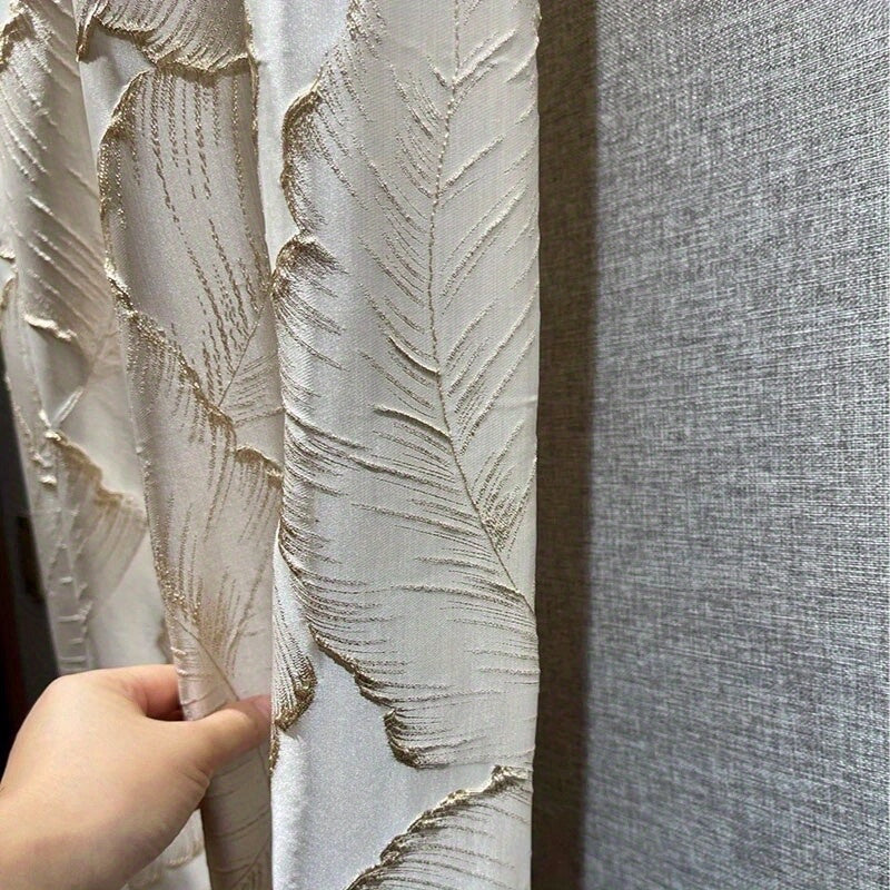 Luxurious embossed bronzing leaf curtains with semi blackout feature, perfect for living rooms and bedrooms. These curtains feature a jacquard design with a 3D plant pattern, adding a touch of elegance to any room. The grommet top farmhouse drapes are a