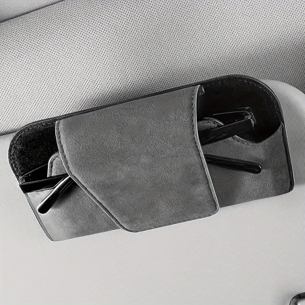 Car visor glasses holder made of PU leather for universal fit in vehicle for convenient eyeglasses storage.