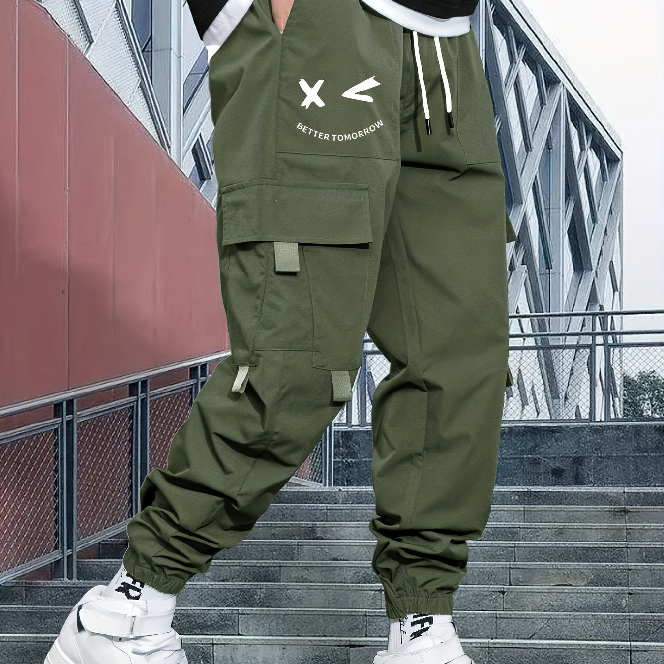 Stylish cargo pants with multiple pockets for men, featuring a loose fit and drawstring waistband for a casual outdoor streetwear look.