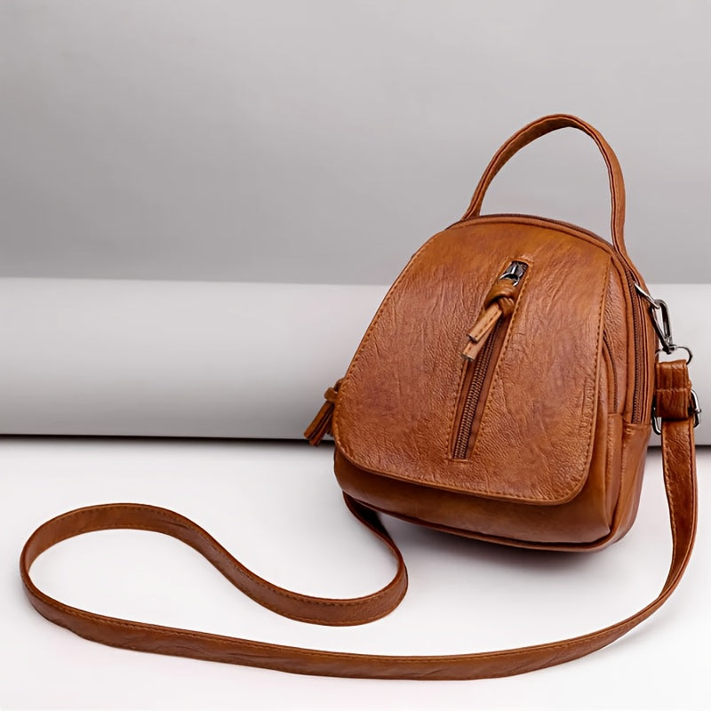 Unisex brown PU crossbody bag with zipper.