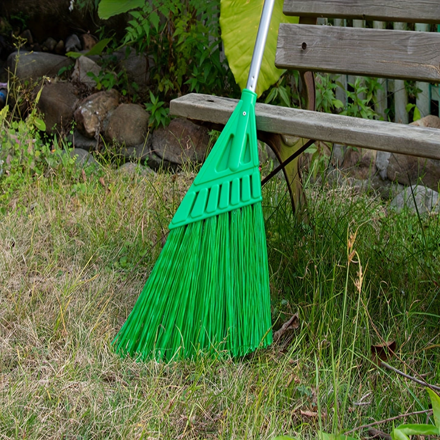 Long-handled outdoor commercial angle broom ideal for courtyards and hard floors.