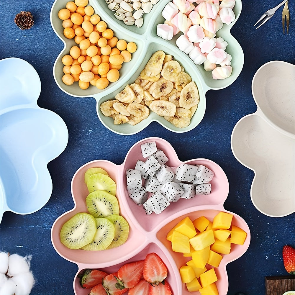 4 durable heart-shaped party snack serving trays in blue, green, beige, and pink. Perfect for organizing snacks at parties and gatherings. Made of lightweight plastic.