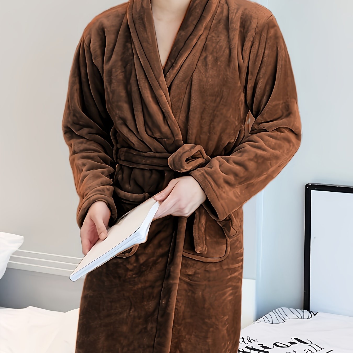 Luxurious plush fleece bathrobe for cozy autumn/winter comfort. Features thick, warm material, long sleeves, v-neck, tie belt, and is machine washable.