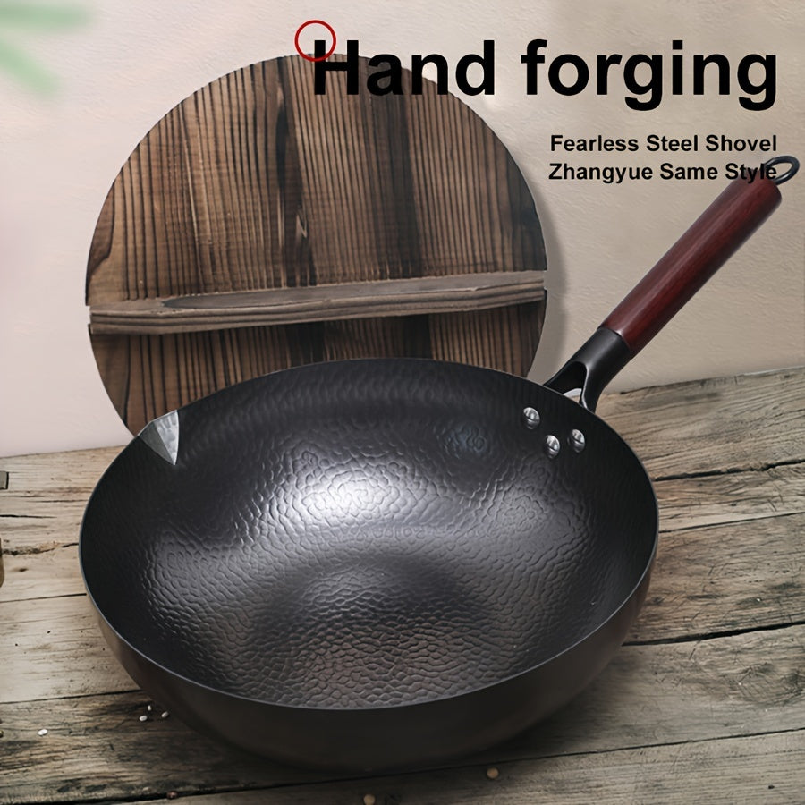 Traditional hand-forged 32cm/12.6in iron wok and stir-fry pan comes with a wooden lid. This non-coated, non-stick pan should be hand washed only. It features a durable cast iron handle and is compatible with smooth surface non-induction cooktops.