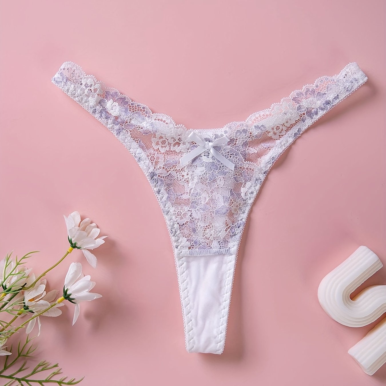 Sexy lingerie and underwear for women, including floral lace thongs and cut-out bow tie panties.