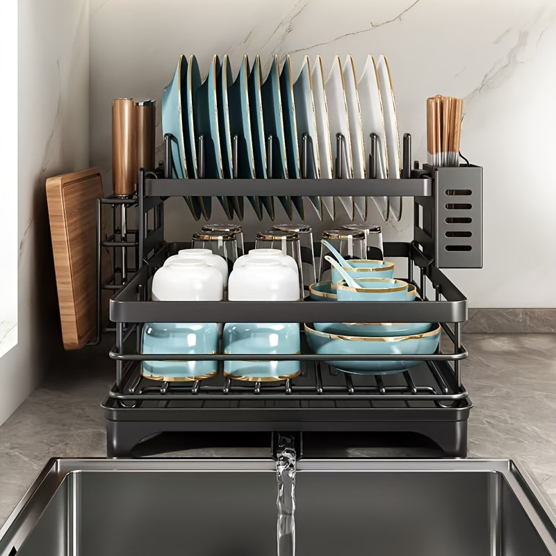 Black iron 2-tier kitchen dish rack with drainboard, utensil holder, cup hooks, and foldable design for space saving. Ideal for drying plates, bowls, pots, and cutlery.