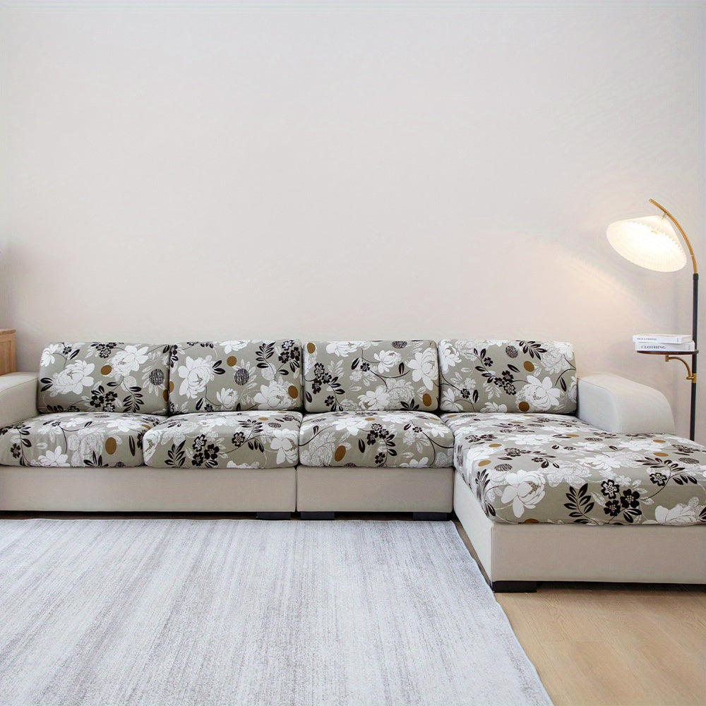 Waterproof flower printed sofa slipcover for furniture protection in various settings.